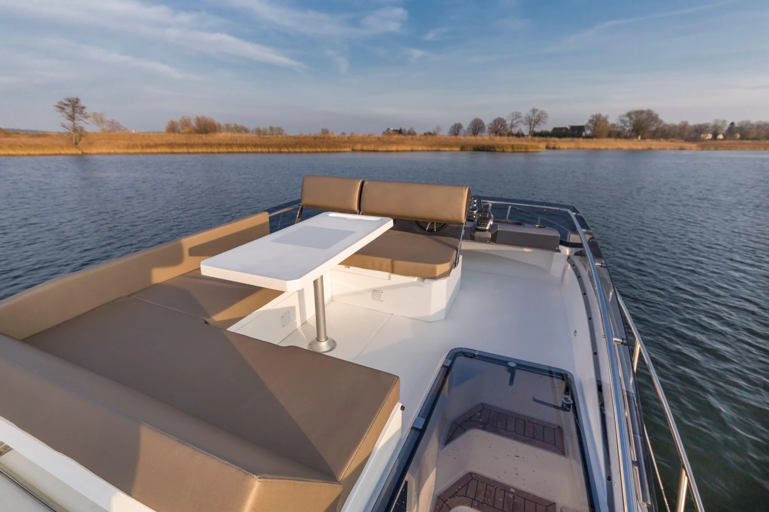 2025 Galeon 360 Fly yacht with spacious deck seating on calm water.