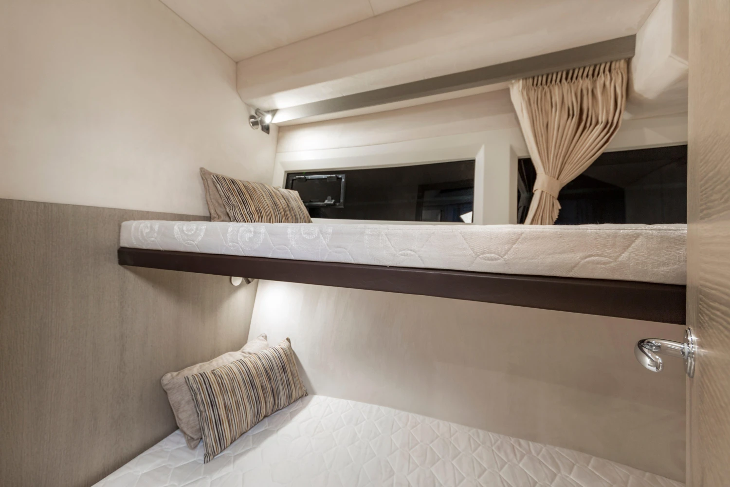 Bunk beds in 2025 Galeon 360 Fly yacht cabin, featuring modern design and cozy bedding.