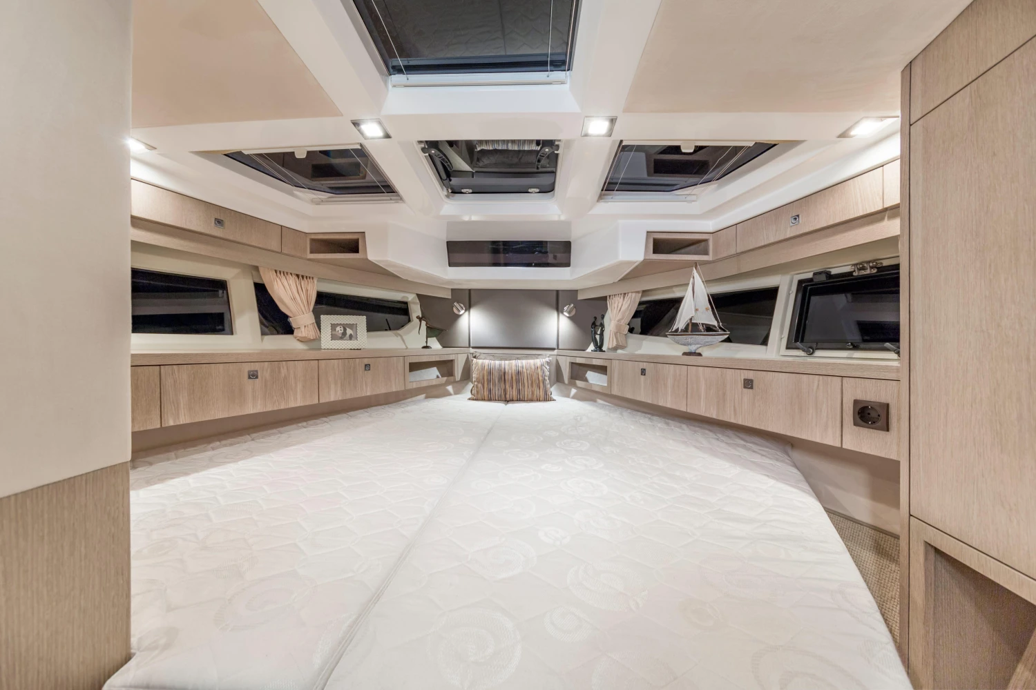 Luxurious interior of 2025 Galeon 360 Fly yacht, featuring elegant wood finishes and spacious design.