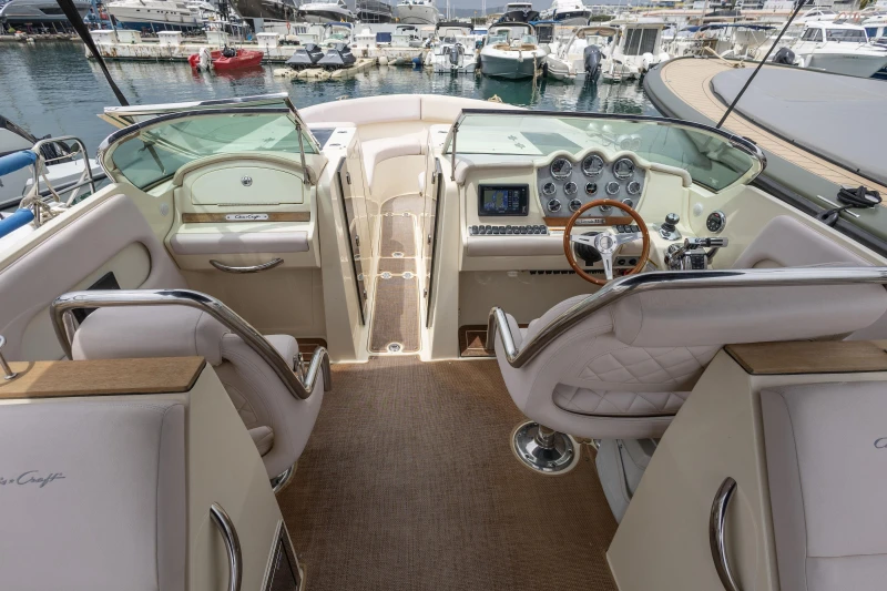 2013 Chris-Craft Launch 32 boat interior with luxurious seating and modern dashboard.