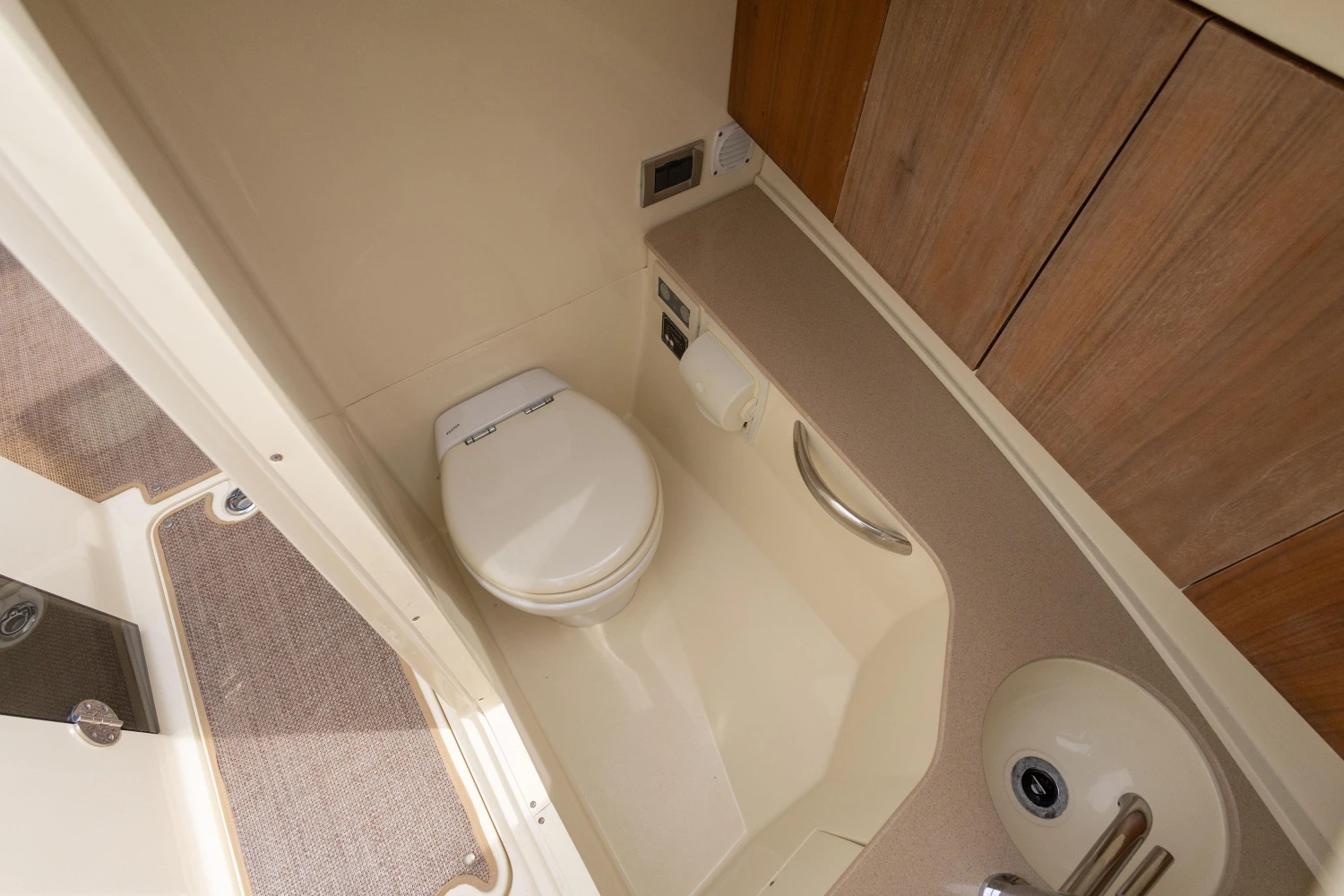 2013 Chris-Craft Launch 32 boat bathroom with toilet and sink.