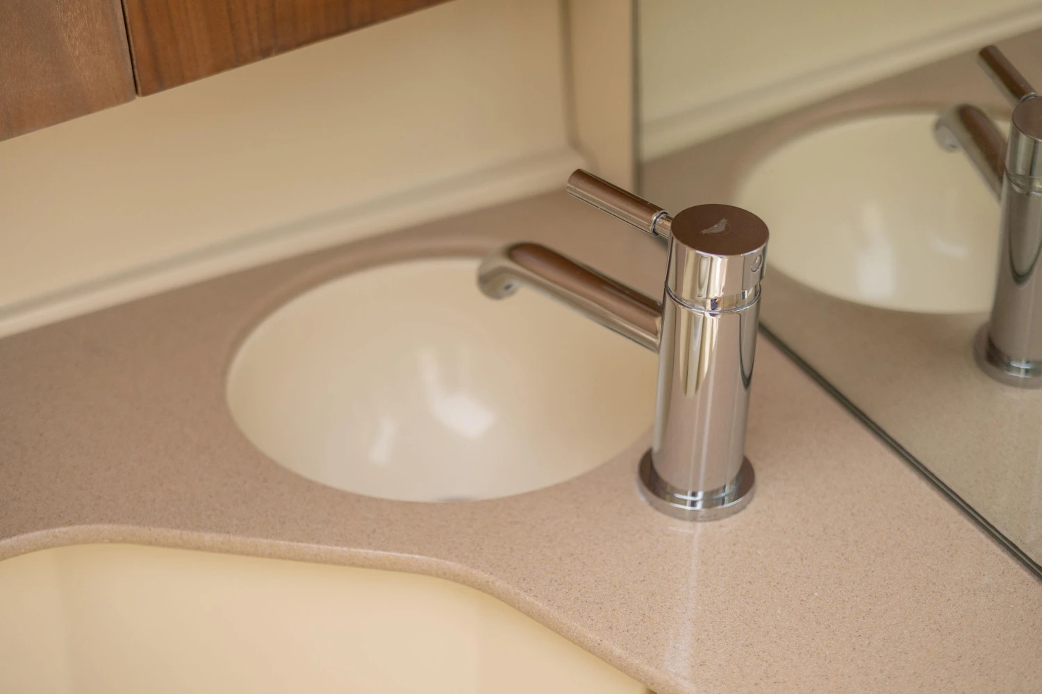 Modern sink and faucet in 2013 Chris-Craft Launch 32 boat bathroom.