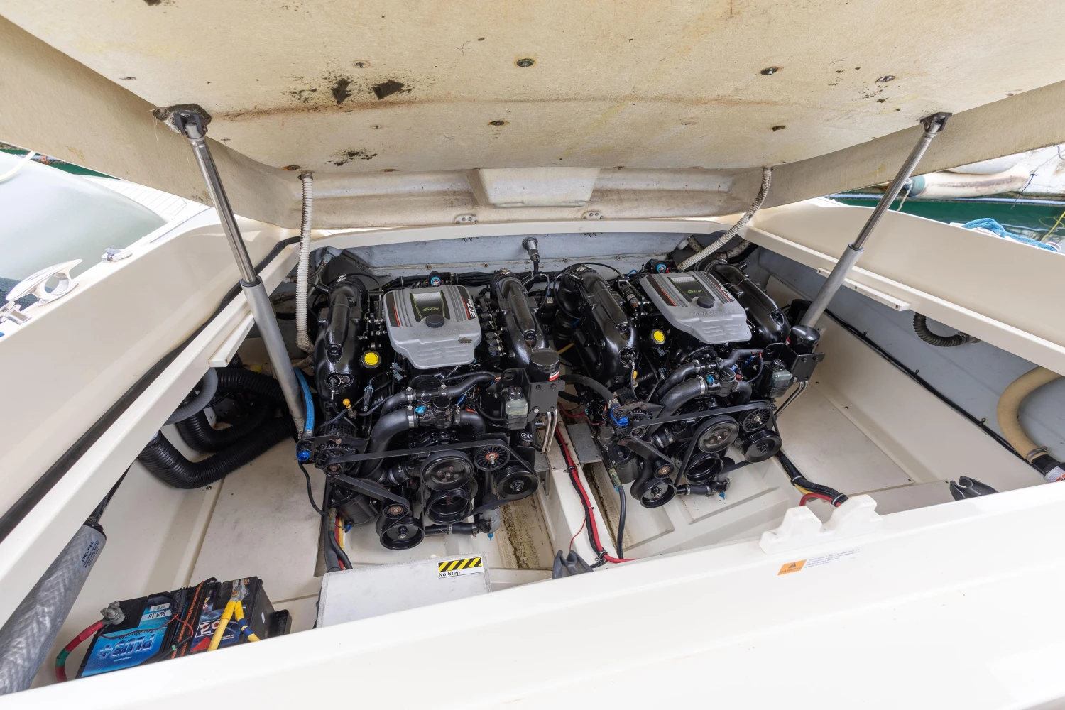 Engine compartment of 2013 Chris-Craft Launch 32 boat, featuring dual engines.