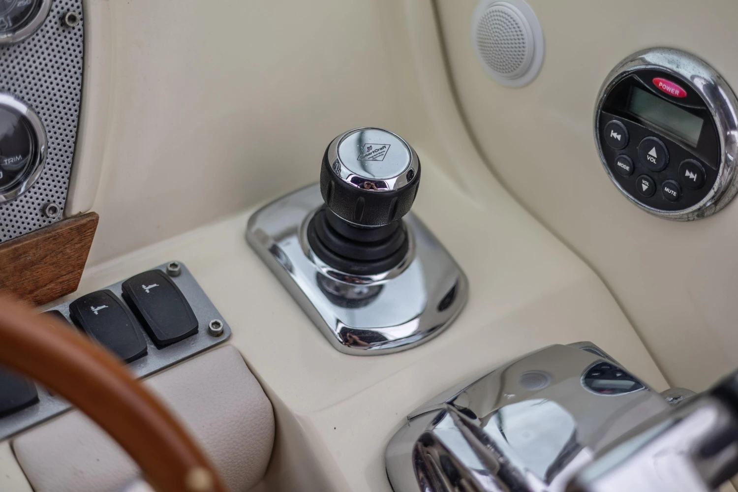 Control panel of a 2013 Chris-Craft Launch 32 boat, featuring joystick and audio controls.