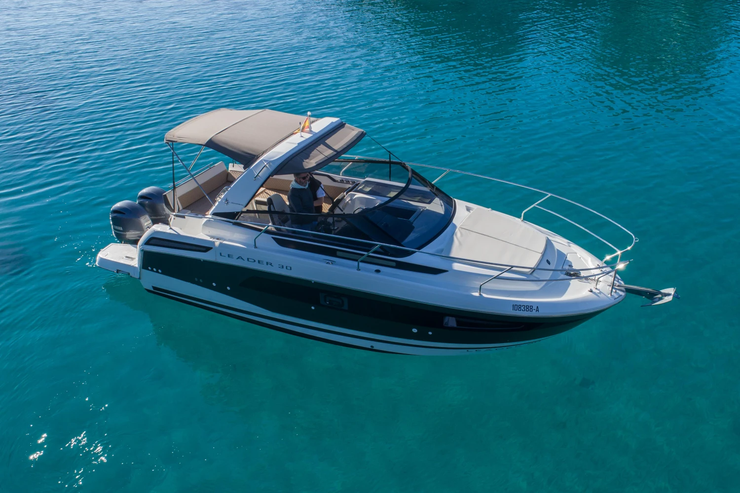 2018 Jeanneau Leader 30 boat on clear blue water.
