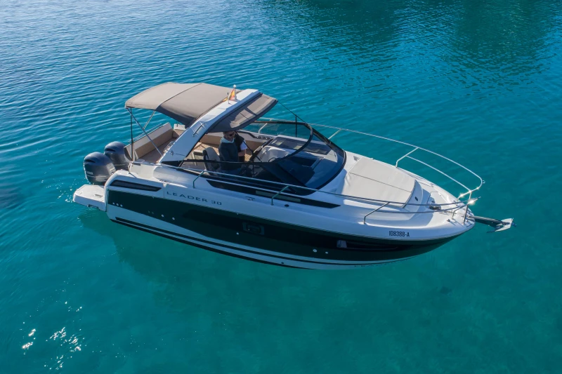 2018 Jeanneau Leader 30 boat on clear blue water.