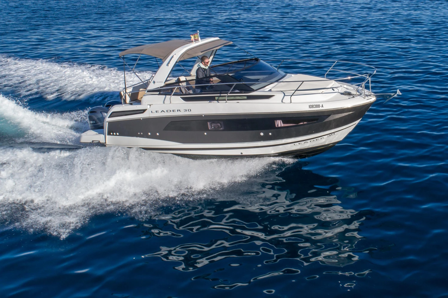 2018 Jeanneau Leader 30 cruising on open water, showcasing sleek design and performance.