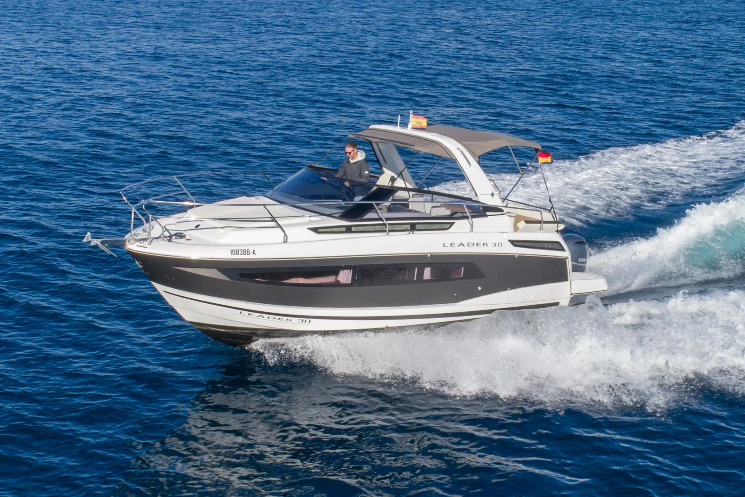 2018 Jeanneau Leader 30 cruising on open water, showcasing sleek design and performance.