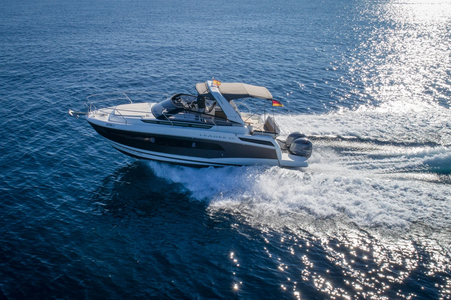 2018 Jeanneau Leader 30 cruising on open water under clear skies.