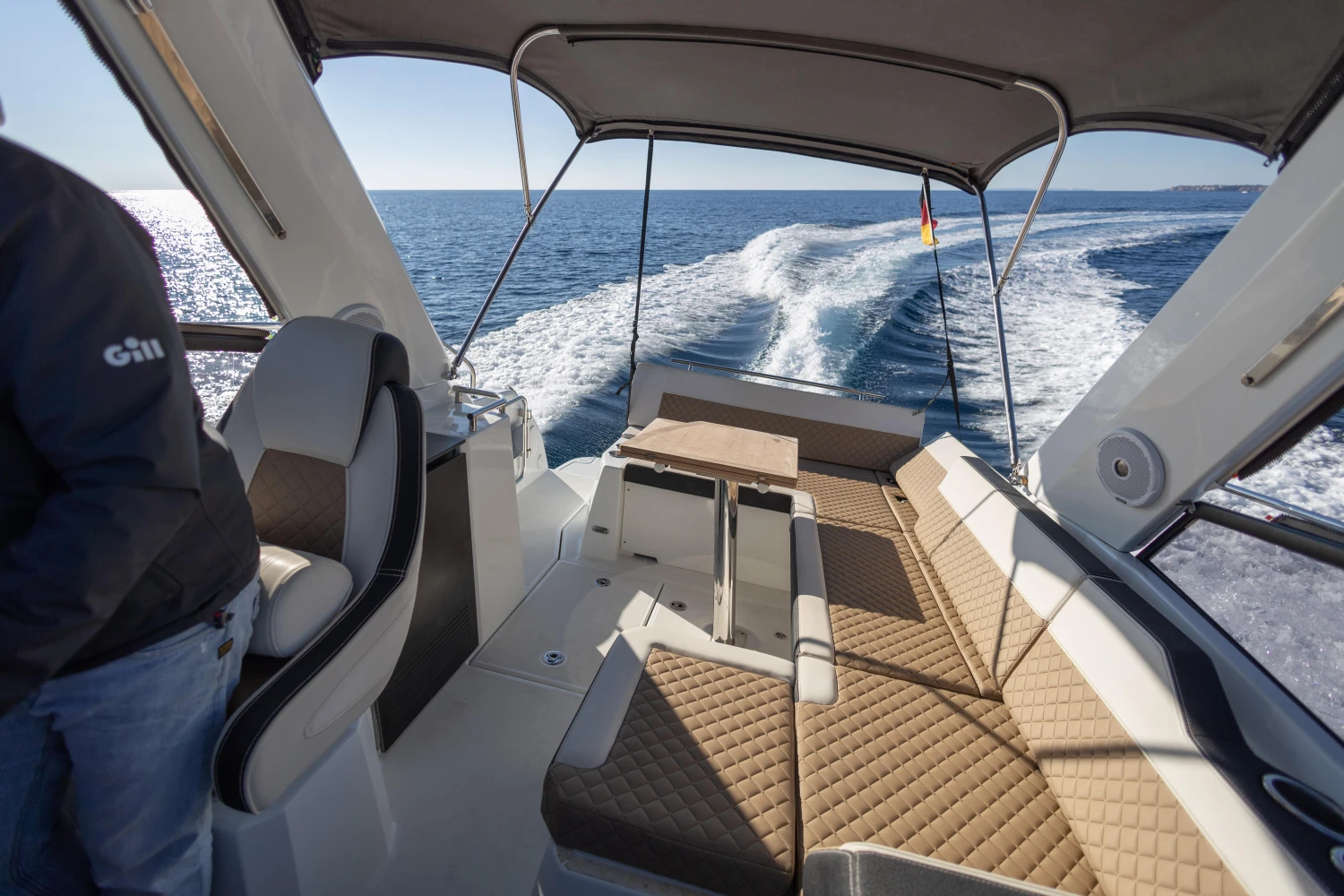 2018 Jeanneau Leader 30 cruising on open water, featuring spacious seating and modern design.