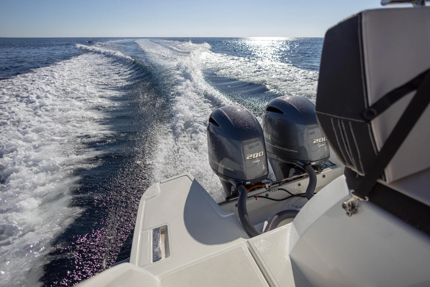 2018 Jeanneau Leader 30 boat with dual 200 horsepower engines cruising on open water.