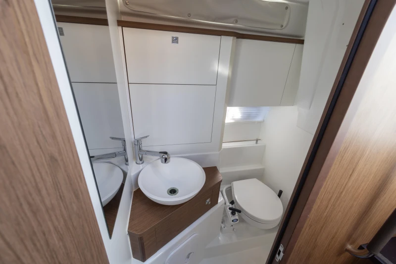 2018 Jeanneau Leader 30 bathroom with modern sink and toilet.