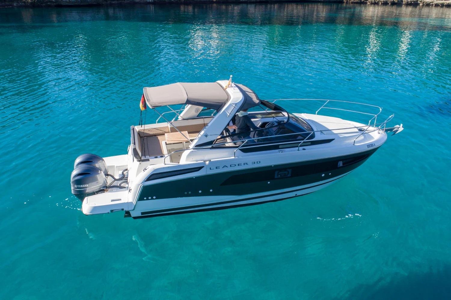 2018 Jeanneau Leader 30 boat on clear blue water.