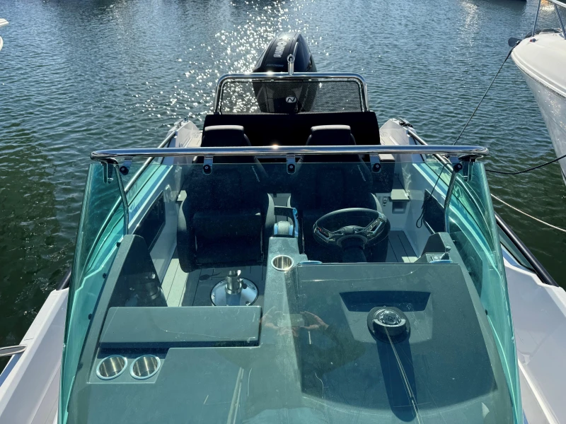 2023 Nordkapp Enduro 705 boat with sleek design and modern dashboard on water.