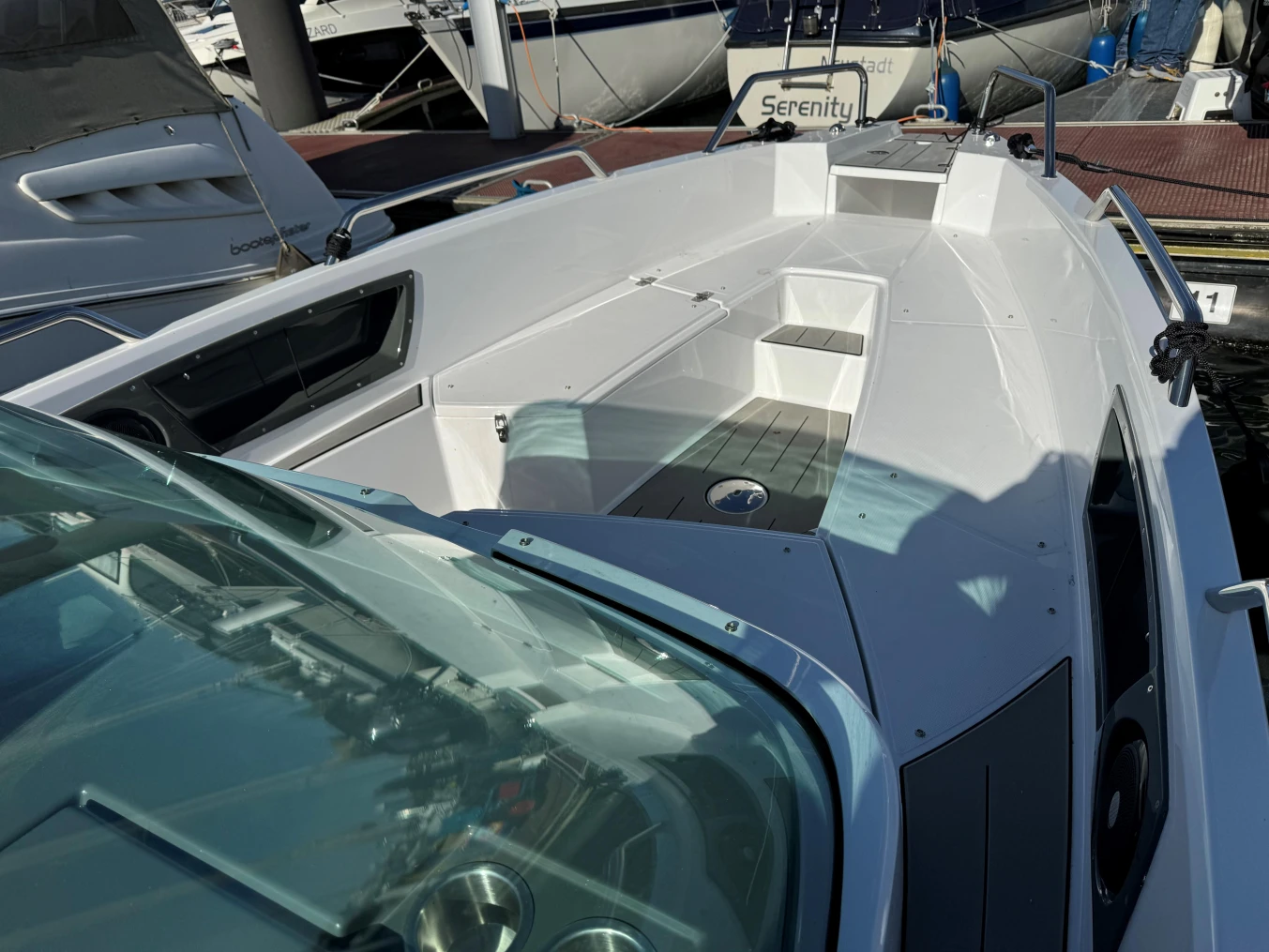 2023 Nordkapp Enduro 705 boat docked, showcasing sleek design and spacious deck.