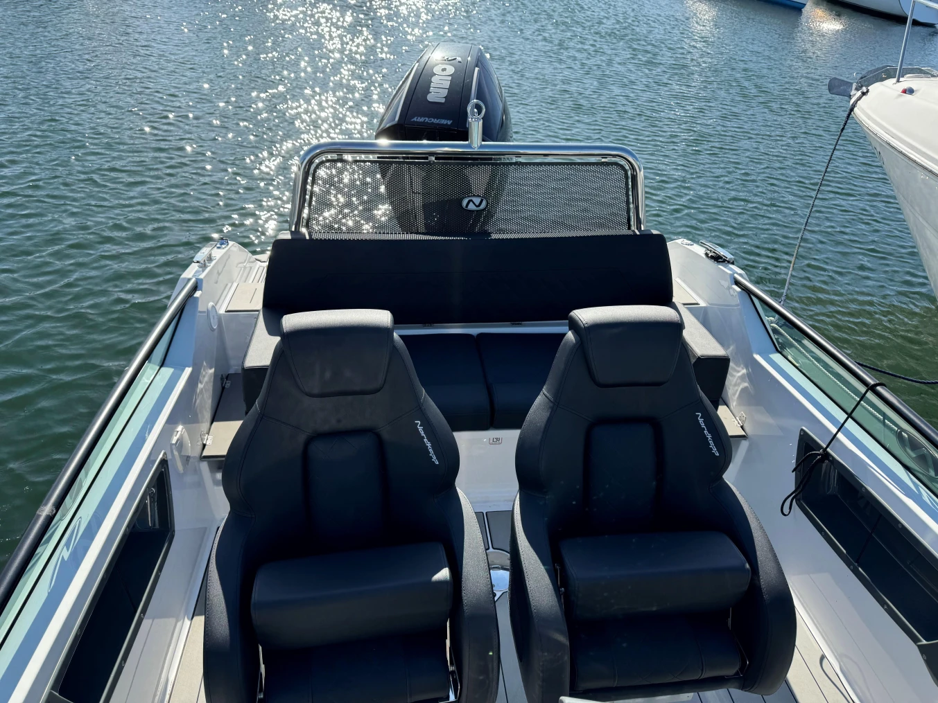 2023 Nordkapp Enduro 705 boat interior with seating, on calm water.