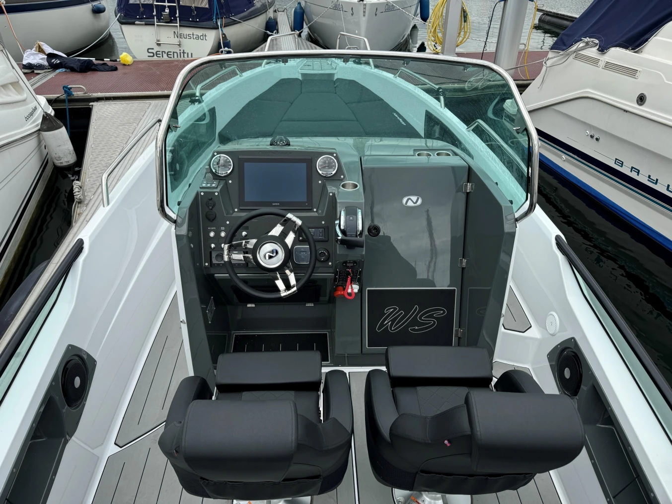 2023 Nordkapp Enduro 705 boat cockpit with modern steering and dual seats.