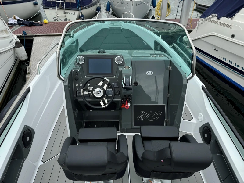 2023 Nordkapp Enduro 705 boat cockpit with modern steering and dual seats.