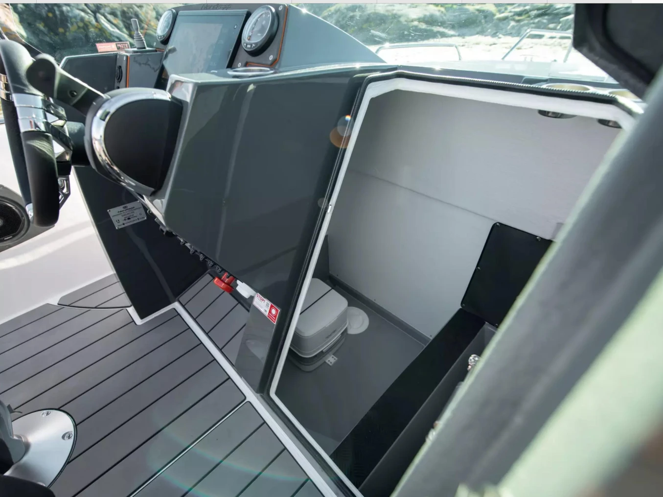 2023 Nordkapp Enduro 705 boat interior with storage compartment and modern dashboard.