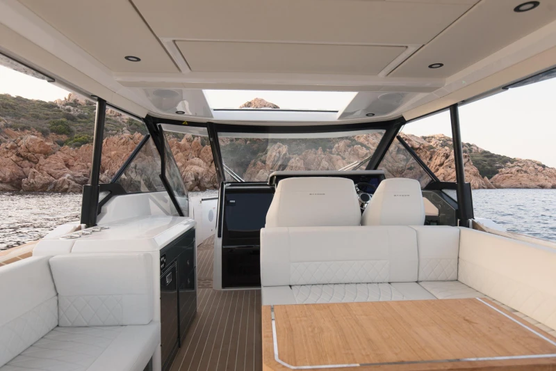 Interior of 2025 Saxdor 400 GTO yacht with luxurious seating and scenic ocean view.
