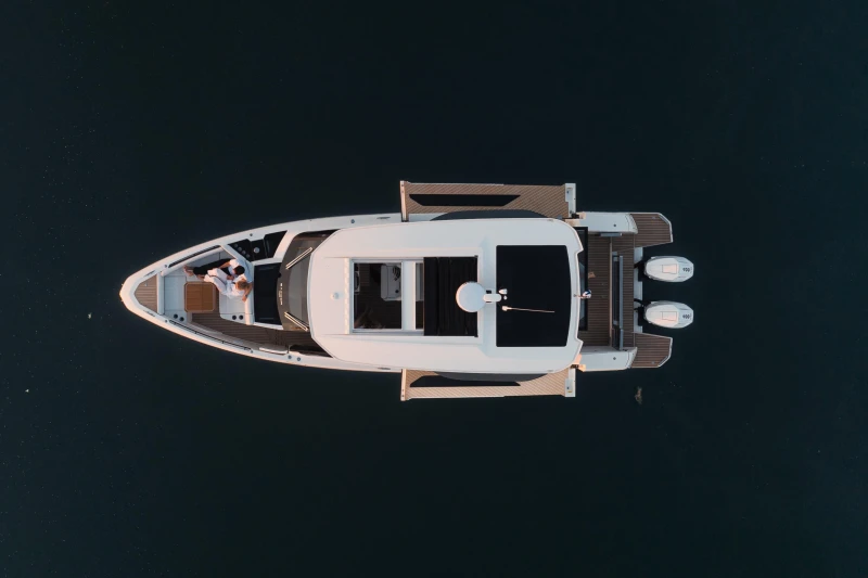 Aerial view of 2025 Saxdor 400 GTO boat on calm water.
