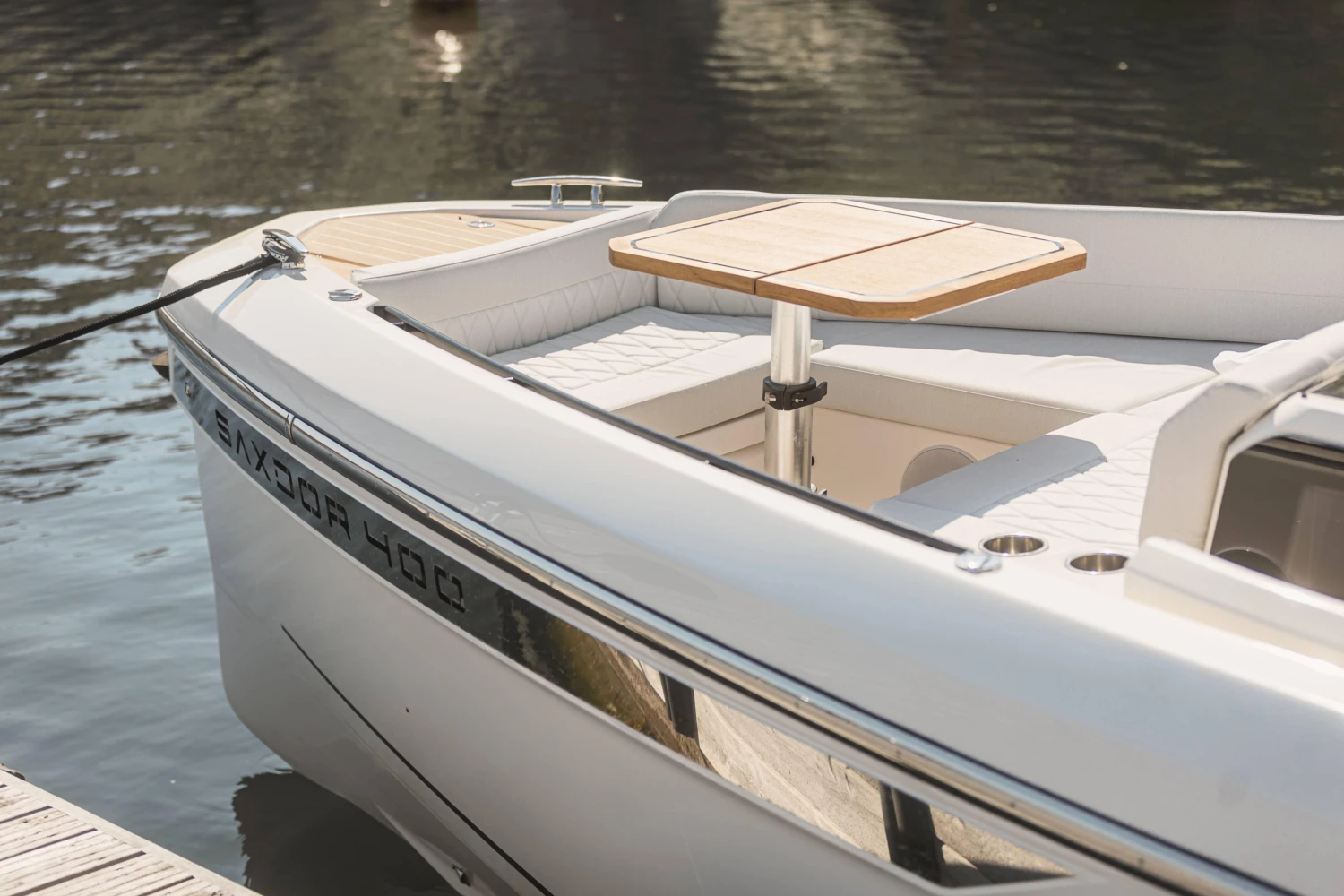 2025 Saxdor 400 GTO boat with sleek design and elegant seating area.