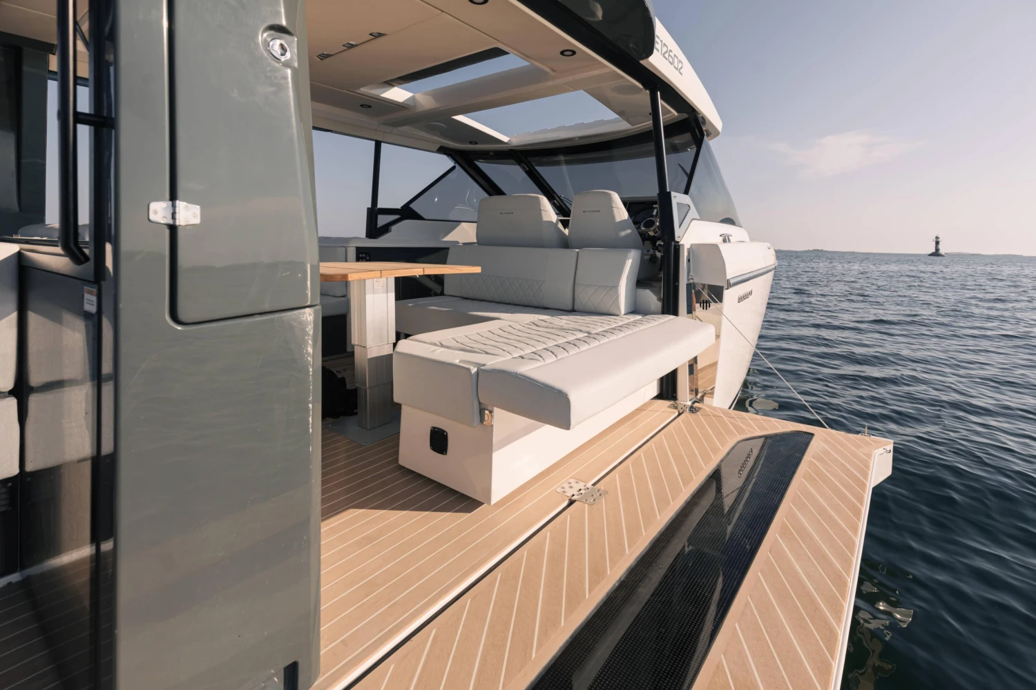 2025 Saxdor 400 GTO luxury yacht interior with seating and table on open water.