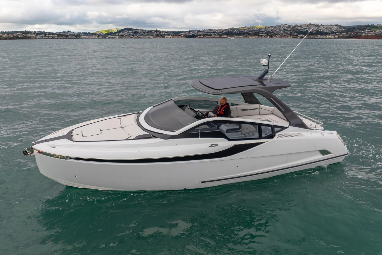 2023 Fairline F//Line 33 luxury yacht cruising on open water.