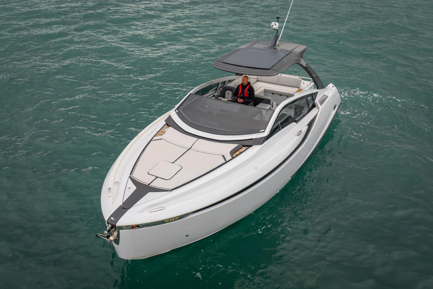 2023 Fairline F//Line 33 luxury yacht cruising on open water.
