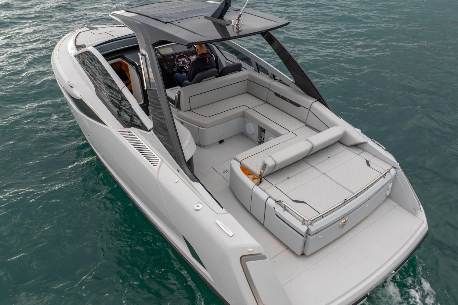 2023 Fairline F//Line 33 luxury yacht cruising on open water.
