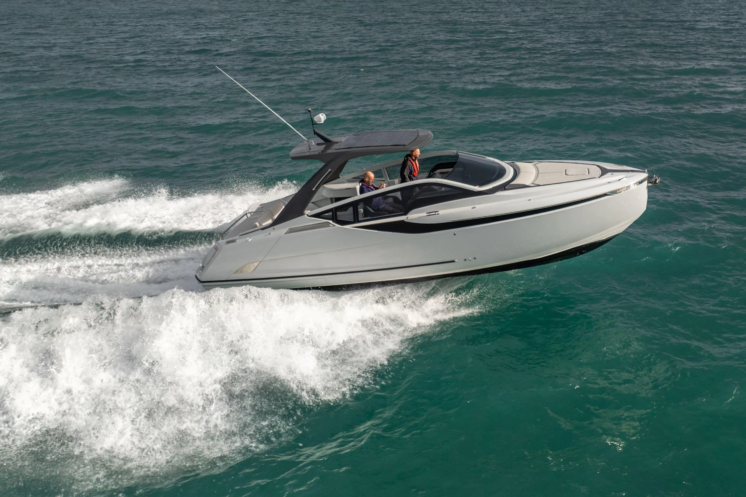2023 Fairline F//Line 33 cruising on open water, showcasing sleek design and performance.