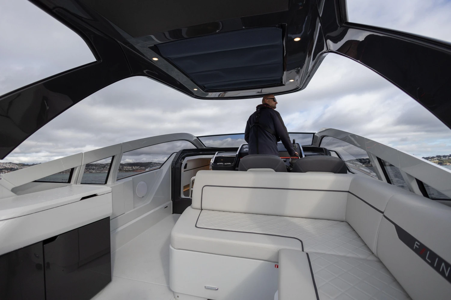 2023 Fairline F//Line 33 luxury yacht interior with modern seating and sleek design.