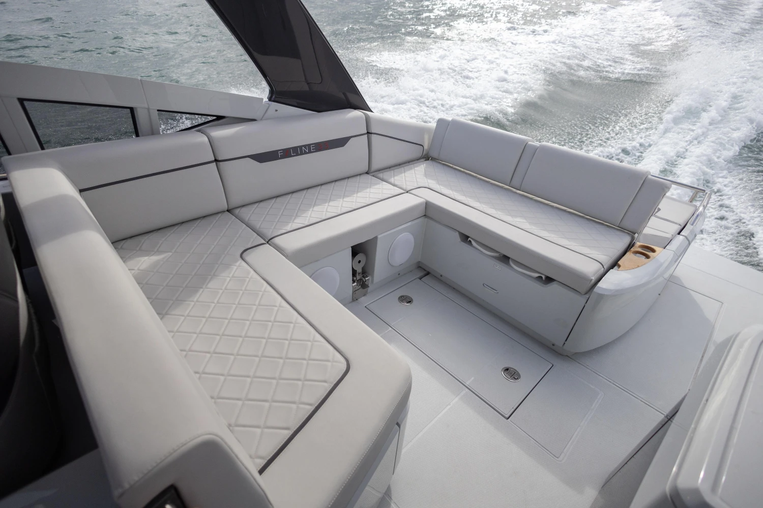 2023 Fairline F//Line 33 yacht interior with luxurious seating and sleek design.