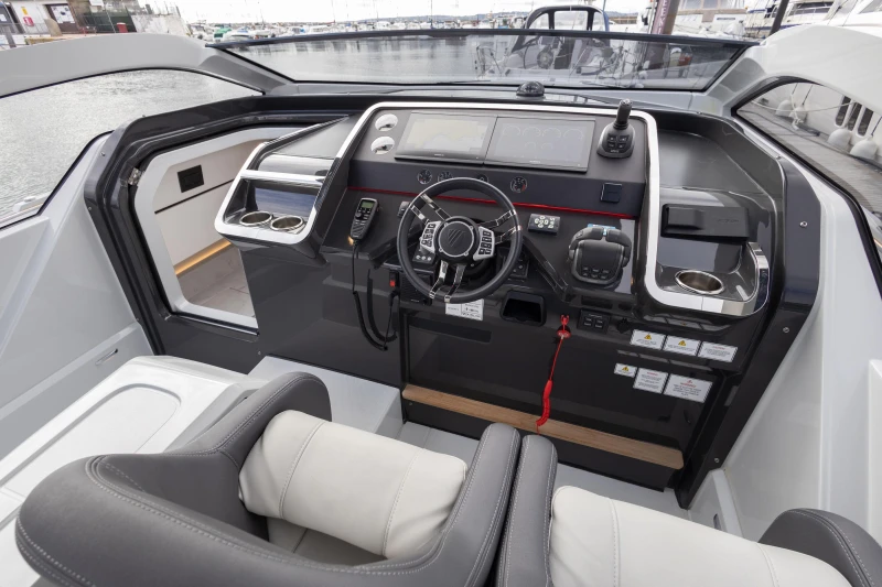 2023 Fairline F//Line 33 cockpit with modern controls and luxurious seating.