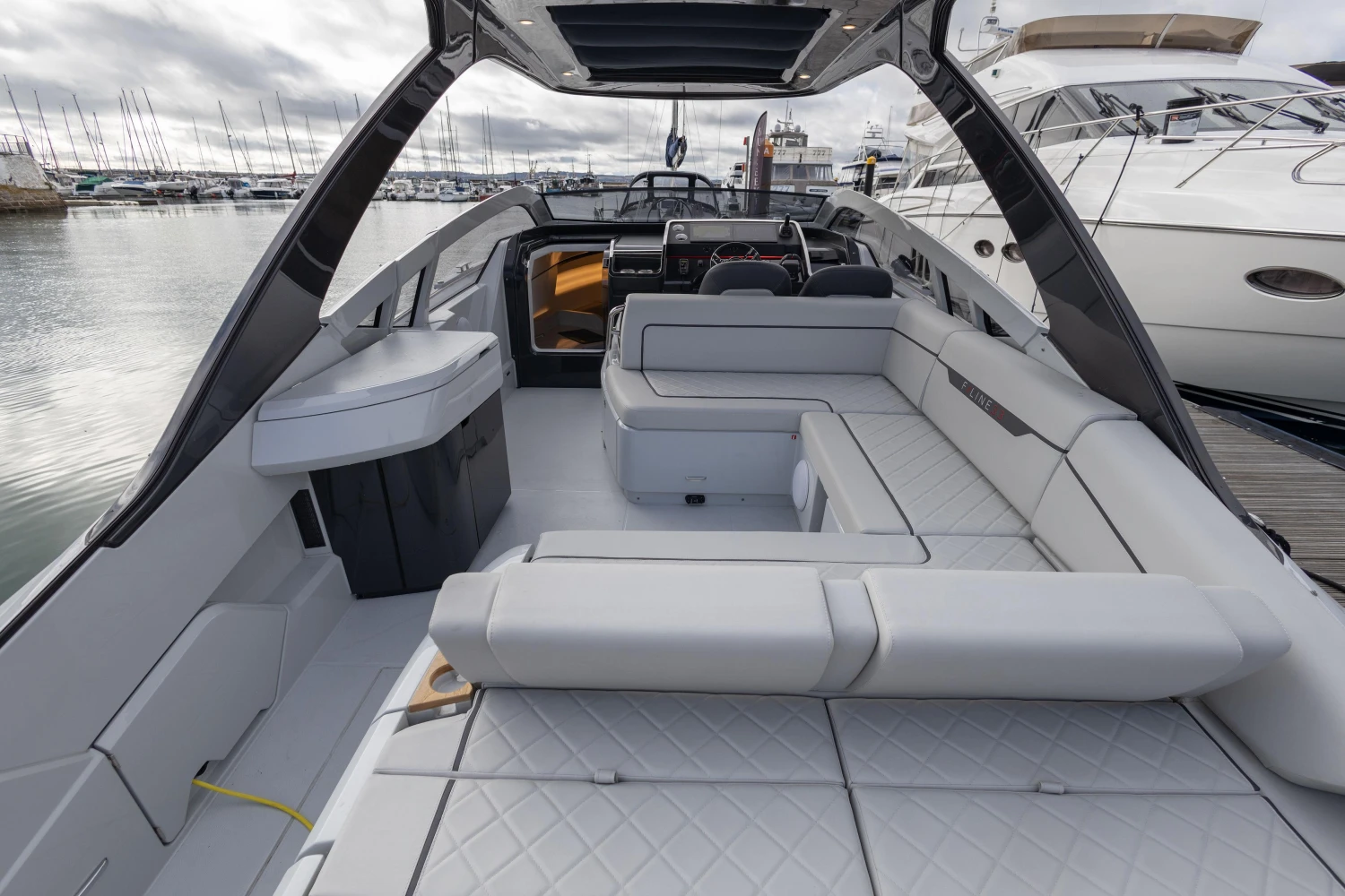 2023 Fairline F//Line 33 luxury yacht interior with spacious seating and modern design.