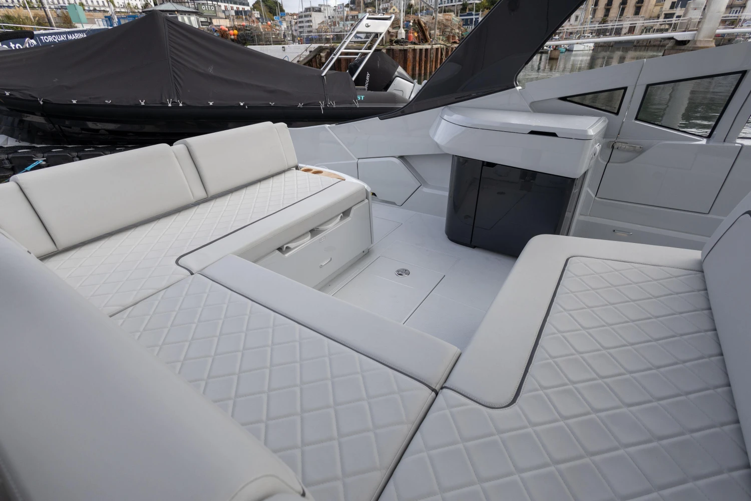 2023 Fairline F//Line 33 yacht interior with luxurious seating and modern design.