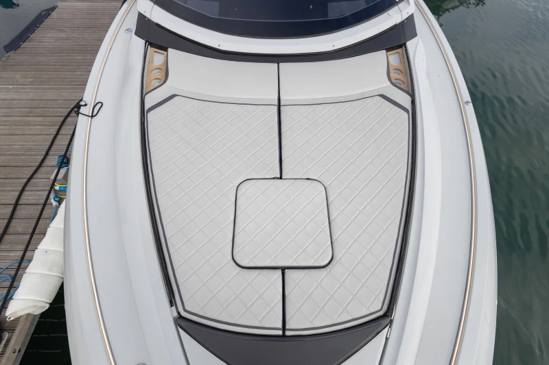 2023 Fairline F//Line 33 yacht bow with sleek, modern design and cushioned deck.