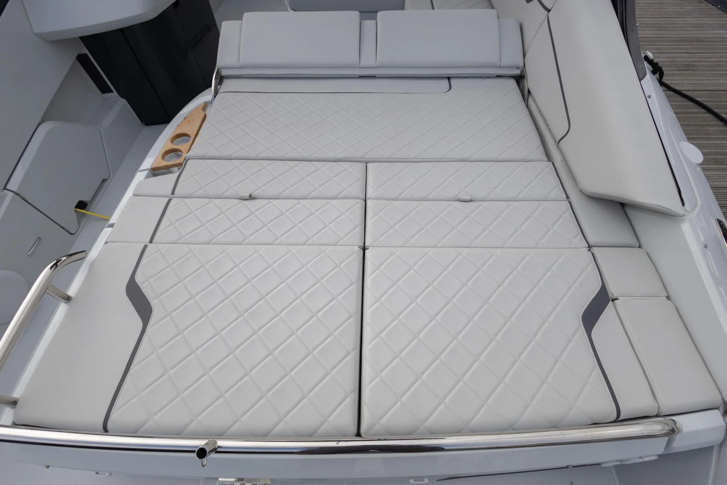 2023 Fairline F//Line 33 yacht with luxurious white cushioned seating area.