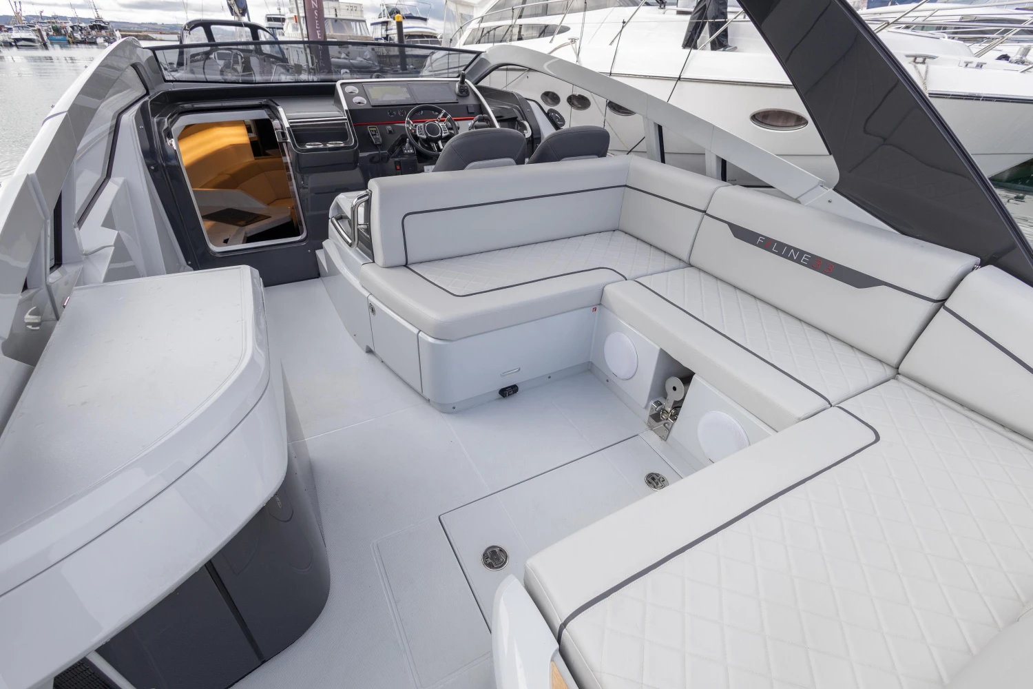 2023 Fairline F//Line 33 yacht interior with luxurious seating and modern design.