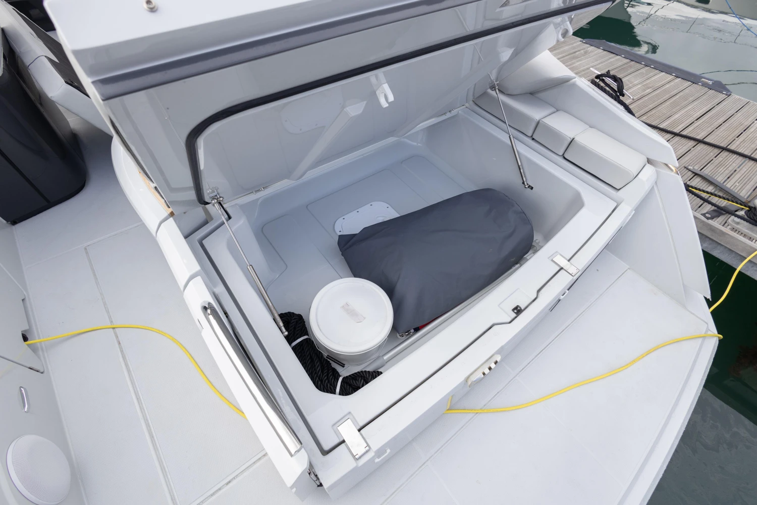 2023 Fairline F//Line 33 boat storage compartment open, showing interior space and equipment.