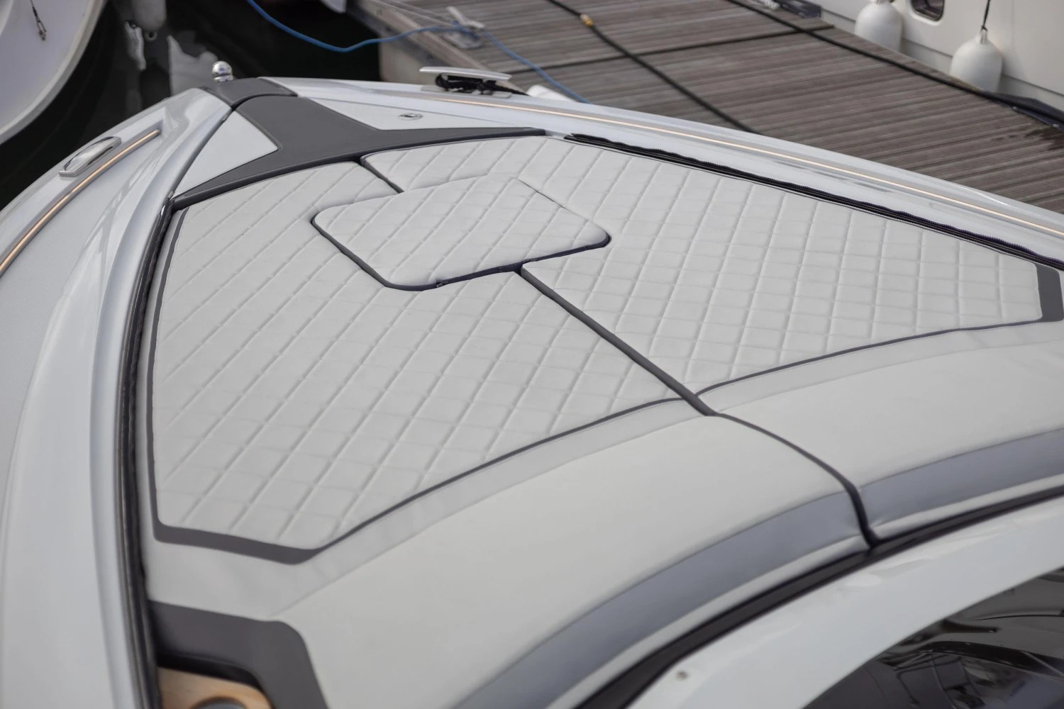 2023 Fairline F//Line 33 boat deck with sleek, modern design and cushioned surface.