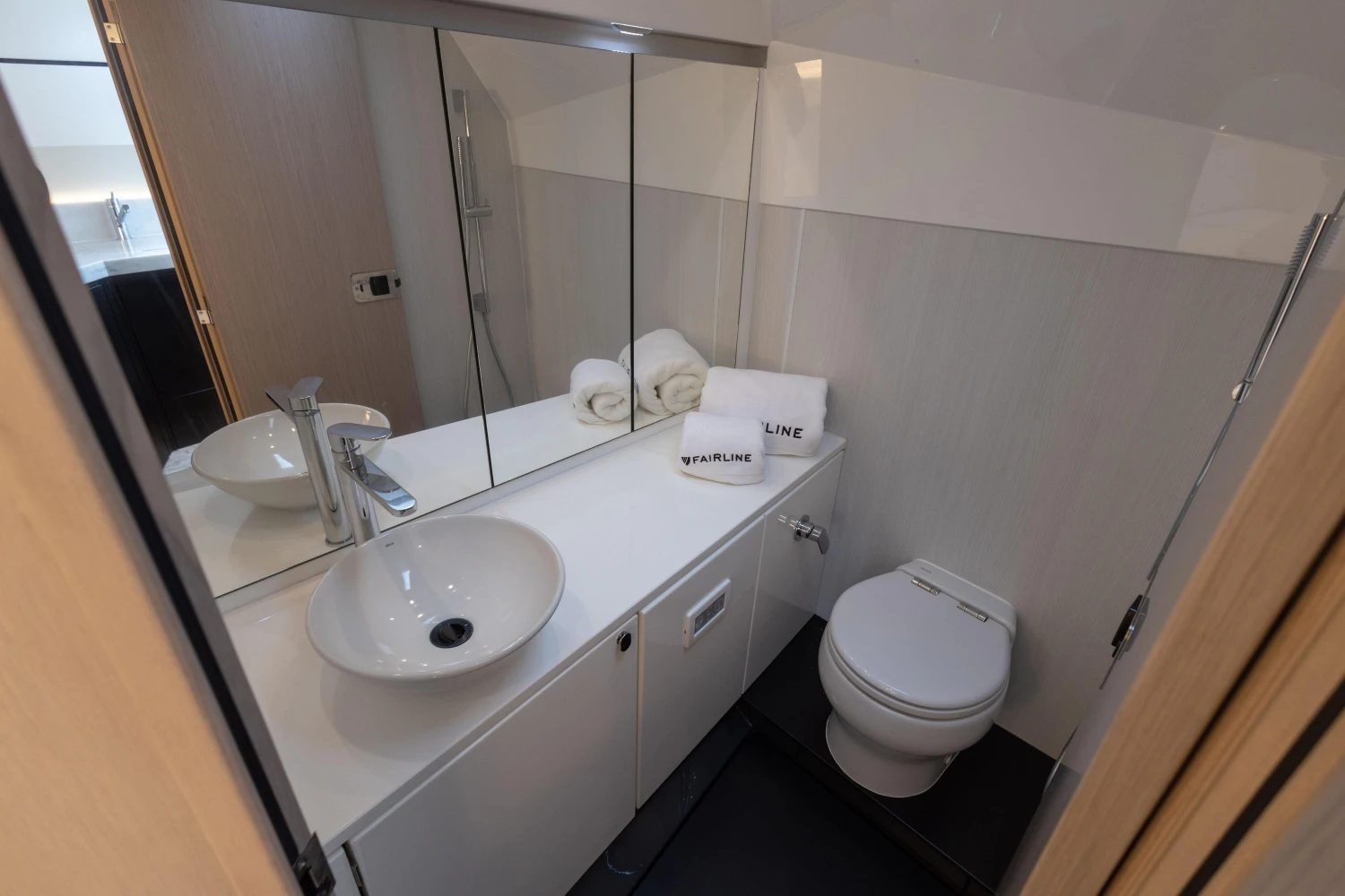 Modern bathroom in 2023 Fairline F//Line 33 yacht with sleek fixtures and elegant design.